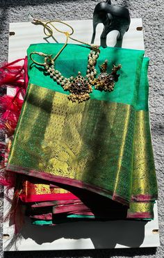 🧵Pure Kanchipuram Silk Saree in Green   with self embossed motifs all over the body gives the festive look .  🧵Green color  body and pink  pallu & Vanasingaram borders is just a classic kanchipuram style of elegance .  🧵Blouse - Yes ( Stitched ) 🧵 Fall pico done  ✅ . 🧵Shipping - As Applicable . 🧵No Returns and Exchanges!! Traditional Gold Pre-draped Saree With Self Design, Traditional Gold Pre-draped Saree For Navratri, Gold Pre-draped Saree With Traditional Patterns For Festivals, Gold Saree With Traditional Patterns In Tissue Silk, Festive Bollywood Handloom Pre-draped Saree, Traditional Gold Tissue Silk Choli, Gold Pre-draped Saree For Puja And Eid, Gold Pre-draped Saree For Puja And Festivals, Handloom Saree For Wedding And Diwali