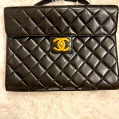 Chanel's Super Soft Lambskin Leather With Stunning Gold Hardware. This Classy Piece Has An Inside Zipper As Well As An Open Pocket, With A Pocket On The Back. Approx Dimensions 14.5"Length X 11.5." Height X 2" Width Rarely Used And Cared For And Is In Excellent Condition! Quilting Is Still Puffy, With No Dents And Only Very Minor Wear (Scratches). Hardware Has No Scratches Or Flaws. Includes Box And Dust Bag, Which It Has Always Been Stored In. Smoke Free Home! Please No Low Ball Offers. Designer Handheld Business Shoulder Bag, Designer Satchel Briefcase With Detachable Handle, Designer Office Bag With Rectangular Case, High-end Briefcase With Detachable Handle, High-end Briefcase With Removable Pouch For Formal Use, High-end Briefcase With Removable Pouch For Formal Occasions, Designer Satchel Bag For Formal Occasions, High-end Formal Briefcase With Removable Pouch, Designer Formal Shoulder Bag