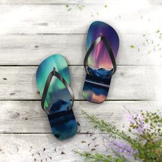 "All-day comfort is the name of the game when summer is on. With an easy slip-on aurora borealis design, a cushioned footbed, and top-tier printing fidelity, these flip flops are a must have! Key Features:  .: 5/8\" (15 mm) thick EVA sole .: 100% polyester suede sole cover .: Runs true to size .: Black PVC strap .: Multiple sizes Stay Connected: Follow us on Instagram (@phoenixbywombdesigns) for the latest updates, exclusive offers, and style inspiration. Explore our Pinterest page (@phoenixwombdesigns) for even more creative ideas and curated collections that ignite your artistic spirit." Dancing Lights, Norway Nature, Hip Hop Dancer, Dance Teacher Gifts, Nature Mountains, Black Pvc, Pet Memorial Gifts, Eva Sole, Unique Christmas Gifts