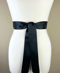 "Narrow Black Sash  Black Satin Sash, Black Sash Belt  Bridesmaid Sash  Black Wedding Dress Sash  Bridal Sash, Wedding Gown Sash  Satin Swank  Now in a narrow version, this Satin Swank® waist sash is the perfect finishing touch for your wedding, bridesmaid, or special occasion dress, or just the right piece to add instant polish to your dress or top.  Depending on your waist size and the length you choose, you can wrap the sash around your waist once or up to three times.  You decide whether to Fitted Satin Bow Sash For Bridesmaids, Fitted Satin Bow Sash For Party, Fitted Ribbon Sashes For Evening, Satin Sash With Bow For Bridesmaids, Formal Fitted Sash With Tie Back, Wedding Sash With Tie Back, Bridesmaid Sash With Satin Bow, Bridesmaid Satin Sash With Satin Bow, Bridesmaid Satin Sash With Bow