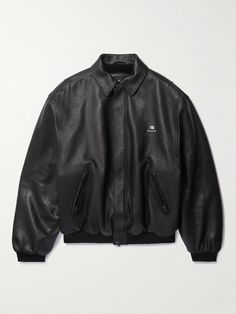 Balenciaga's jacket is embroidered with its 'Sporty B' logo, which riffs on late '90s sportswear. Made in Italy from soft black leather, it has a covered placket and pockets on each side to slot your hands into. The oversized fit is a signature and emphasised by the dropped shoulders and ribbed trims. Designer Streetwear Outerwear With Embroidered Logo, Designer Outerwear With Embroidered Logo For Streetwear, Designer Black Outerwear With Embroidered Logo, Classic Outerwear With Embroidered Logo For Streetwear, Designer Leather Jacket For Winter Streetwear, Balenciaga Leather Jacket, Balenciaga Clothes, Trendy Leather Jacket, Balenciaga Jacket