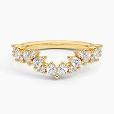 a yellow gold ring with five pear shaped diamonds