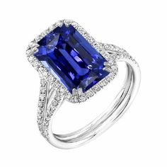 a blue sapphire and diamond ring on a white background