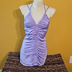 Size Sm, Satin Feel, Never Worn Purple Stretch Mini Dress For Party Season, Lavender V-neck Mini Dress For Party, Lavender Ruched Mini Dress For Summer, Lavender Fitted Mini Dress For Summer, Fitted Lavender Mini Dress For Summer, Fitted Lavender Mini Dress For Date Night, Purple Stretch Flirty Mini Dress, Lavender Sleeveless Mini Dress For Night Out, Flirty Stretch Purple Mini Dress