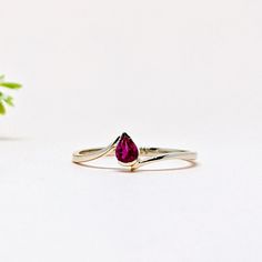 14K Solid Yellow GOLD Stackable One of a Kind Everyday Ring in 14k Gold For Her on Mothers Day from our Capsule Jewelry Collection. NATURAL RUBY Ring in 14k SOLID YELLOW GOLD. Ruby Pear Faceted Stone is set in Half Bezel Setting in our Factory. Gold Ring AAA+ Quality Ruby Precious Gemstone Ring. Etsy Handmade Jewelry, Handmade Ring For Wedding Gift , Engagement Gift  Anniversary Gift, Mothers Day Gift   (Stamped 585 /14k ) Ring. Perfect Gift For Everyday or Gift for a July Birthstone for Your Loved Ones. Christmas Gift  ►  DIMENSIONS : ◆ Gemstone : Ruby                                                                   ◆ Stone size : 3*5 mm                           ◆ Stone Shape : Pear                              ◆ Cut : Faceted  ◆ Gross Weight : 1.040 grams ◆ Stone Weight :  Ruby 0.30 Ct 14k Gold Teardrop Jewelry With Bezel Setting, Ruby Rings With Accent Stones For Promise, Ruby Promise Ring With Accent Stones, Fine Jewelry Teardrop Anniversary Rings, Gold Teardrop Emerald Promise Ring, Fine Jewelry Teardrop Ring For Anniversary, Fine Jewelry 14k Gold Pear-shaped Diamond Ring, Fine Jewelry Ruby Open Ring For Promises, Ruby Open Ring For Promise