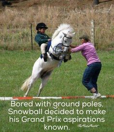 a woman riding on the back of a white horse next to a person jumping over an obstacle