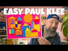 a man holding up a colorful painting with the words easy paul klef