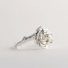 Sterling Silver Rose Ring, Handmade Silver Ring, Women Flower Ring This beautiful, delicate open rose ring would make a stunning statement piece. The band resembles the delicate stem of the rose and every ring is individually handmade so that no two pieces are exactly the same! This makes a truly special gift for yourself or a loved one. * Ring band Material: Sterling Silver * Size of Rose: Approx 1.5 cm (0.59in) diameter 0.6 cm (0.23 in) height * Ready to Ship in 2-4 business day * Made in the Silver Flower Ring With Roses For Wedding, Silver Wedding Ring With Roses, Elegant Rose Sterling Silver Flower Ring, Elegant Rose Flower Ring In Sterling Silver, Elegant Sterling Silver Rose Design Flower Ring, Elegant Sterling Silver Rings With Roses, Dainty Rose Design Flower Ring For Anniversary, Elegant Floral Rings With Rose Details, Dainty Rose Design Flower Promise Ring