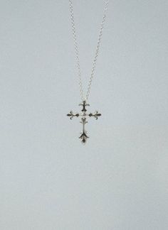 Introducing the Mini Fleur Cross, a beautifully handcrafted piece made in the heart of New York. This exquisite pendant is constructed using only the finest materials, available in your choice of solid 925 sterling silver or gold vermeil (sterling silver gold plated) Each piece is meticulously crafted to order, ensuring the highest level of quality and sustainability. Please allow for one week of production time. THE MINI FLEUR CROSS IS HANDMADE IN NEW YORK WITH SOLID 925 STERLING SILVER OR STER Gold Small Cross Necklace, Trending Silver Jewelry, Dainty Gothic Jewelry, Heart Silver Ring, Silver Etched Cross Necklace, Vintage Silver Cross Necklace, Silver Cross Necklace Aesthetic, Silver Pendant Necklace Unique, Silver Vintage Jewelry