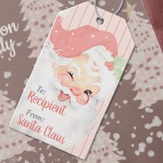 a christmas gift tag with santa claus's face on it and the words, to recipient from santa claus