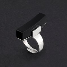 Black Onyx Vertical Bar Ring Modern Onyx Open Ring Jewelry, Modern Black Jewelry With Rectangular Stone, Modern Black Adjustable Rings, Modern Onyx Open Ring, Modern Black Enamel Jewelry, Modern Black Jewelry, Modern Black Open Ring, Contemporary Adjustable Black Jewelry, Modern Black Ring With Rectangular Stone