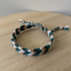 A handmade bracelet or anklet woven with shades of white, green, and orange colors. A friendship or statement bracelet perfect for this summer! Made with high quality embroidery thread. Approx. 9 inches/ 30 centimeters long. Made in a smoke free, pet free home. White Braided Bracelet For Friendship, White Braided Friendship Bracelet, White Braided Beaded Bracelets As Gift, Casual Handmade Orange Friendship Bracelets, Casual White Friendship Bracelets For Festivals, White Braided Casual Jewelry, Casual White Braided Bracelets For Festival, Adjustable White Woven Friendship Bracelets, White Bohemian Braided Friendship Bracelets