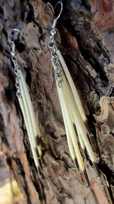 Porcupine quill chain dangle earrings that cascade from ear and beautifully displays mother's natures bounties. 100% Natural. Length: 3 1/2 Inches; Width: 1/2 Inches These quills were ethically sourced from a vehicle hit porcupine. No porcupines were injured or harmed on our behalf. We provided a proper burial for him. All quills are given a bath in a natural cleaning sloution. Due to utilizing Mother Earths gifts, every piece will uniquely differentiate from the next. We capture each piece as it is found in nature, unadultered. Some pieces may display imperfections which add to the natural character of each individual piece. DISCLAIMER: I am not a member of any state or federally recognized tribes nor do I or have I ever claimed to be. This shop and our crafts are inspired by my Tsalagi(C Porcupine Jewelry, Porcupine Quill Jewelry, Quill Jewelry, Quill Earrings, Quill Work, Porcupine Quills, Earth Gift, Sci Fi Fashion, Deer Skull