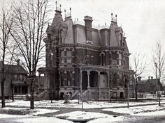 an old building with snow on the ground