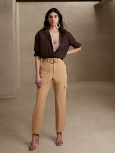 Utility with a twist, this cargo pant is crafted using a luxurious and softly structured fabric, enhanced with advanced stretch for a refined look and feel.  SLIM FIT: High waisted, slim through hip and thigh, tapered leg.  Ankle length.  Zip fly with hook and bar closure.  Removable belt.  Front, back and side cargo pockets.  Pleated detail at the cuff.  Unlined.  SLIM FIT: High waisted, slim through hip and thigh, tapered leg.  Ankle length.  Ankle length.  Inseams: Petite/Short 24", Regular 2 Cargo Pants Outfit, Tan Pants, Work Fits, Outfits For Work, Style Mistakes, Cargo Pant, Fashion Mistakes, Professional Outfits, Business Casual Outfits