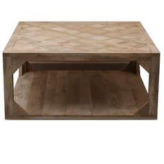 a wooden coffee table sitting on top of a hard wood floor