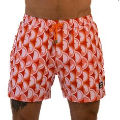 Step back in time to the 70s with East x East Island Fever men's shorts. Featuring a bold orange colorway and a retro-inspired design, these shorts are the perfect addition to any fashion-forward individual's summer wardrobe. Made with premium sustainable materials, these shorts not only look great but are eco-friendly too. The elasticated waist and drawstring adjustment ensure a comfortable and secure fit, making them perfect for any summer activity, from beach days to pool parties. With their Summer Activity, Orange Design, Pool Parties, 70s Inspired, Step Back, Beach Days, Mens Swimwear, Retro Vibe, Upgrade Your Style