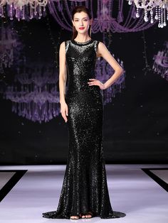 Make a memorable entrance in this dazzling black mermaid dress, perfect for the mother of the bride. Taking inspiration from the showstopping  formal sequin dress, this gown features a scoop neckline and elegant long sleeves. The floor-length hemline gracefully flows, crafted from luxurious sequin fabric in a timeless black hue. The form-hugging mermaid silhouette is adorned with sparkling crystal embellishments, adding a touch of glamour to this exquisite creation. A zipper-up back completes the look, ensuring a breathtaking presence at any special occasion. Style with statement earrings, a bracelet, and heels for a truly unforgettable ensemble. Formal Sequin Dress, Black Mermaid Dress, Pink Ball Gown, Blue Ball Gowns, Black Mermaid, Mermaid Sequin, Sequin Evening Dresses, Vintage Gowns, Sparkly Dress