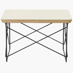 a white table with black metal legs and a wooden tray on top, against a white background