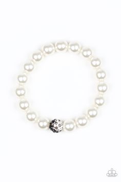 Pearly white beads are threaded along a stretchy band around the wrist. Radiating with white, black, and smoky rhinestones, a black and white bead adorns the center for a refined flair. Sold as one individual bracelet. White Bracelet, White Bracelets, Paparazzi Accessories, Paparazzi Jewelry, Rhinestone Bracelet, White Beads, Pearl Bracelet, Stretch Bracelets, Pearl White