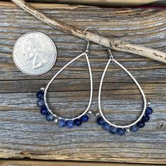 Silver Teardrop Earrings wire-wrapped with Sodalite Semi-Precious Beads and Silver Spacer Beads: These earrings are light weight, comfortable, simple and fun. Throw them on with any outfit and they will definitely add some pop They are approximately 2.25 inches in length and 1.15 inches at the widest portion. Included are nickel free ear wires and silicone earring backs. If you would like these in a different color or size, please let me know as I also do customized orders. To view more of my or Silver Wire-wrapped Teardrop Earrings, Wire Wrapped Teardrop Drop Earrings, Wire Wrapped Metal Chandelier Earrings, Silver Teardrop Wrap Earrings, Metal Teardrop Beaded Earrings With Ear Wire, Metal Beaded Teardrop Earrings With Ear Wire, Adjustable Teardrop Beaded Metal Earrings, Adjustable Teardrop Jewelry With Ear Wire, Bohemian Teardrop Pendant Jewelry With Ear Wire