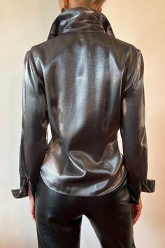 Chic Sheen Tops For Fall, Chic Fall Tops With Sheen, Sleek Blouse For Night Out, Chic Sheen Blouse For Night Out, Chic Blouse With Sheen For Night Out, Chic Long Sleeve Tops With Sheen, Glamorous Metallic Tops For Fall, Metallic Long Sleeve Tops For Work, Glamorous Fitted Office Tops