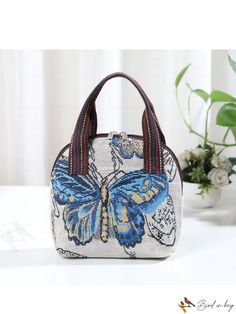 BirdinBag - Embroidered Butterfly Canvas Handbag with Phone Pouch - Stylish and Practical Casual Embroidered Rectangular Bag, Embroidered Satchel Shoulder Bag For School, Embroidered Beige Tote Bag, Beige Embroidered Tote Bag, Embroidered Shoulder Bag For School, Large Capacity Handheld Cosmetic Bag, Handheld Large Capacity Cosmetic Bag, Embroidered Rectangular Travel Bag, Embroidered Beige Satchel For Everyday Use