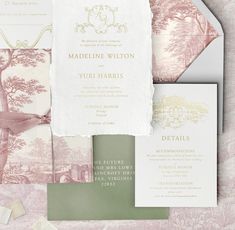 the wedding stationery is laid out on top of each other, including pink and green paper