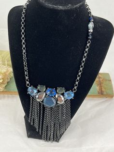 Add a bohemian touch to your outfit with this Chico's Panel Blue Glass Necklace. The necklace features a unique panel style with blue glass beads and an unknown metal base. Perfect for any occasion, this necklace is sure to add a pop of color to your look. The necklace measures [insert measurements here] and is ideal for those who love to add a little bit of flair to their wardrobe. Get ready to turn heads with this trendy and stylish necklace! Stylish Necklace, Glass Necklace, Fashion Jewelry Necklaces, Metal Base, Blue Glass, Fashion Watches, The Necklace, Pop Of Color, Jewelry Necklace Pendant