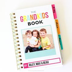 the grandkids book by riley max and beau on a white background with colored pencils