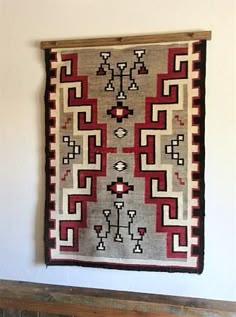 an old rug hanging on the wall