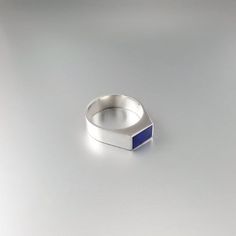 Beautiful modern ring with Lapis Lazuli and Sterling silver. Unique gift for her or him, girlfriend, wife, mom, friend, September and December birthstone, 8 year anniversary. The natural blue Lapis Lazuli stone is cut to a rectangle shape and set in Sterling silver. This beautiful ring is worked with the technique of inlay, which means the stone is worked seamlessly into the Sterling silver. All our inlay work is real stone, not ceramic stone dust. All our stones are natural stones and our jewel Modern Jewelry Ring For Anniversary, Modern Blue Sapphire Jewelry, Formal Sterling Silver Jewelry With Simple Design, Modern Sterling Silver Signet Ring Gift, Blue Polished Open Ring Jewelry, Blue Open Ring Jewelry With Polished Finish, Modern Jewelry With Polished Finish For Promise Ring, Modern Sterling Silver Rings For Promise, Modern Rings With Birthstone For Gifts