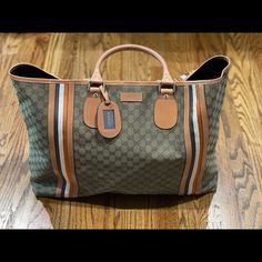 Serious Shoppers Only. Gorgeous And Never Carried Gucci Overnight Travel Bag. Can Be Used As A Large Beach Bag Or Large Travel Tote. This Is From My Personal Collection And I’ve Never Used It So It Is Brand New. No Flaws. Comes From A Non Smoking Home With No Pets/Pests. Comes With Original Cards And Dust Bag. Measures 16*24*5 (Approximately) This Is 100% Authentic. Inside Has A Zipper Pocket. Bag Closes With Clasp Hardware, See Pics. Hardware Is Gold. This Bag Holds A Lot. It’s Big!!! Truly A C Designer Rectangular Travel Bag For Shopping, Designer Rectangular Travel Bag, Luxury Shopping Travel Bag With Handles, Designer Travel Bag With Leather Handles For Shopping, Designer Travel Bag With Double Handle For Shopping, Designer Shopping Travel Bag With Double Handle, Designer Double Handle Travel Bag For Shopping, Designer Coated Canvas Travel Bag With Handles, Designer Brown Travel Bag With Top Handle