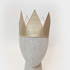 These metallic gold crowns are great for any royal themed event, birthday party, or anyone trying to finish a king, queen, prince, or princess costume. Each crown is made from metallic twill with embroidered edges. Crowns have adjustable hook/loop fastening in the back to fit a range of sizes (one size fits most). OPTIONAL PLUSH SHERPA TRIM - You can choose to have this crown with or without a soft sherpa trim along the bottom. Custom Designs are available upon request. Gold Costume Hats And Headpieces For Carnival, Gold Crown Costume Hat, Gold High Crown Costume Hat, Gold Crown Costume Headpiece For Weddings, Gold Tall Crown Costume Hats And Headpieces, Gold Costume Hat With Tall Crown, Gold Costume Hats With Round Crown, Gold Tall Crown Costume Hat, Gold Regal Teardrop Crown