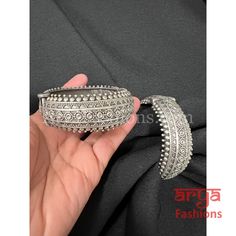 Handmade Silver Oxidized Bracelet Gokhroo Bangles- Available Size: 2.6. Can fit size 2.8 due to openable feature.- Silver Oxidized Bracelet bangles in silver finish.- Very Elegant and stylish, these bracelet bangles can be paired with any Attire depending upon the occasion and the theme. - The base is pure brass (90%) and pure 92.5 silver (10%) which makes this very sturdy and of good quality. - 100% guarantee on the finish- it will not lose its finish/color/shine. - Very lightweight and Hand ca Ceremonial Silver Openable Bangle, Silver Oxidized Finish Fusion Bracelets, Fusion Style Silver Bracelets With Oxidized Finish, Silver Openable Bangle For Festivals, Bohemian Silver Bangle Hand Set, Silver Openable Bracelets As A Gift, Silver Bohemian Bangle With Hand Set Details, Silver Openable Bracelets For Gift, Hand Set Silver Bohemian Bangle