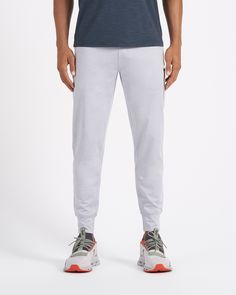 A fresh take on athleisure and a staple in your wardrobe, the Sunday Performance Joggers are premier in fit, function and soft stretch. This jogger style will keep you moving with less bulk around your ankles. | Vuori Sunday Performance Jogger Pants | Platinum Heather | XXL Vuori makes premium performance apparel inspired by the active Coastal California lifestyle; an integration of fitness, surf, sport, and art. Breaking down the boundaries of traditional activewear, we are a new perspective on 4-way Stretch Sportswear Joggers With Side Pockets, Sportswear Bottoms With 4-way Stretch, Functional Moisture-wicking Long Sweatpants, Sportswear Bottoms With Go-dry Technology, Sportswear Comfort Stretch Go-dry Pants, Go-dry Athleisure Bottoms For Gym, Joggers With Pockets For Loungewear, Moisture-wicking Comfort Stretch Athleisure Pants, Functional Activewear With Pockets For Loungewear