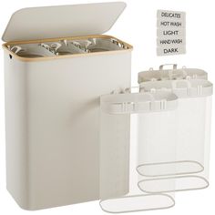 two white containers with lids and labels on the side, one is filled with water