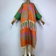 This super soft and warm wool cardigan kimono is perfect for the cold weather. Unlike other sweaters and wools, the wool used for this beauty is non itchy. Think of your favorite throw blanket, the comfort and warmth it gives but 10x stylish and wearable any where. This kimono is all that and more! One size fits S-4X Material: Wool One Size Fits Most Size Chart One Size Acrylic Outerwear For Layering, Long Multicolor Cardigan For Layering, Multicolor Long Cardigan For Layering, Warm Cozy Sweater Coat For Spring, Cozy Warm Sweater Coat For Spring, Cozy Warm Spring Sweater Coat, One Size Long Cardigan For Winter, One Size Long Winter Cardigan, One Size Long Sweater For Fall