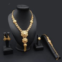 Indulge in luxury with this exquisite Necklace Set, perfect for wedding parties. With its opulent design and superior craftsmanship, this set features a necklace, bracelet, earrings, and ring. Make a lasting impression and elevate your style with this luxurious jewelry set." Wedding Gold Jewelry, African Wedding Jewelry, Nigeria Wedding, Gold Jewelry Set, Luxurious Jewelry, Bridal Accessories Jewelry, Wedding Jewelry Set, Gold Jewelry Sets, Gold Wedding Jewelry