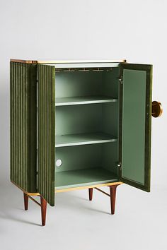 a green cabinet with two shelves and one door open to show the inside of it