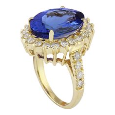 Yellow Gold Tanzanite Rings With Brilliant Cut, Luxury Tanzanite Yellow Gold Ring, Luxury Yellow Gold Tanzanite Ring, Yellow Gold Tanzanite Diamond Ring With Halo Setting, Yellow Gold Diamond Ring With Tanzanite In Prong Setting, Gia Certified Gold Gemstones For Formal Occasions, Elegant Tanzanite Gemstones In Yellow Gold, Yellow Gold Sapphire Gemstones For Formal Occasions, Fine Jewelry Yellow Gold Tanzanite Rings