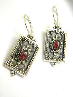 "Garnet earrings sterling silver vintage style Etruscan dangle earrings oval gemstone garnet jewelry. Gift for her Dangle but not to long garnet earrings made in sterling silver. Rectangle with oval natural red garnets and ornate with small granules in Etruscan style. They are easy to wear them everyday and if you like vintage style jewelry this pair is ideal. We have oxidized them and after polished them to shine to achieve the vintage look 35mm - 1 3/8\" long including the ear hooks The garnet Red Garnet Jewelry, Star Garnet, Garnet Jewelry, Vintage Style Jewellery, Garnet Earrings, Red Garnet, Earrings Sterling Silver, Gorgeous Earrings, Looks Vintage