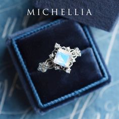 "Our current turnaround time for regular orders is 6-8 weeks. For urgent orders, please shop our Ready-to-Ship collection below (7-10 business days): https://michellia.com/collections/ready-to-ship (please copy and paste into browser) -------- 「Elsa」- Vintage Princess Square Ring, in Rainbow Moonstone | R1005 Inspired by the legendary Queen of Arendelle, this regally luxurious design features an ice-like center stone marked by its unmistakable brilliance. The vintage-inspired filigree details su White Celestial Moonstone Ring In 14k Gold, White Moonstone Celestial Ring In 14k Gold, Silver Moonstone Ring With Rose Cut Diamonds For Wedding, White 14k Gold Moonstone Promise Ring, White Moonstone Promise Ring In 14k Gold, White Moonstone Ring In 14k Gold For Promise, Celestial 14k Gold Opal Wedding Ring, 14k White Gold Moonstone Ring With Rose Cut Diamonds, Silver Moonstone Ring With Center Stone For Wedding