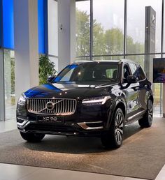 the new volvo xc90 is on display at the company's showroom