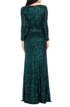 Be a verdant vision in a showstopping gown drenched in dazzle and designed with a leg-flaunting side slit best shown off on the dance floor. 60 1/2" length Hidden back-zip closure Jewel neck Long sleeves Side slit Lined 95% polyester, 5% spandex Hand wash, dry flat Imported Sequined Gown, Sleeve Gown, Long Sleeve Gown, Embellished Gown, On The Dance Floor, Long Sleeve Sequin, Sequin Gown, Mermaid Gown, Dress The Population