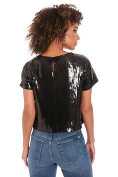 Elevate your casual glamour with our Chelsea sequin t-shirt. This dazzling piece combines the comfort of a classic tee with the allure of all-over sequins, creating a look that's both effortless and eye-catching. Perfect for girls' nights out, birthday celebrations, or adding sparkle to your weekend wardrobe. Pair it with sleek leather pants for an edgy evening look, or dress it down with your favorite jeans for a touch of daytime drama. The Chelsea top ensures you'll shine in any setting, from Casual Glamour, Illusion Dress, Maggy London, Weekend Wardrobe, Birthday Celebrations, The Dance, Crop Tshirt, Dance Floor, Favorite Jeans