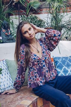 Dahlia Knot Top in Plum - Yoga Clothing by Daughters of Culture Flowy V-neck Printed Tops, Bohemian Flowy V-neck Top, Patterned V-neck Tops For Vacation, Spring Bohemian Relaxed Fit Tops, Bohemian Relaxed Fit Tops For Spring, Printed Long Sleeve Summer Blouse, Bohemian V-neck Tops For Layering, Bohemian Relaxed Fit Tops For Fall, Relaxed Fit Bohemian Top For Fall