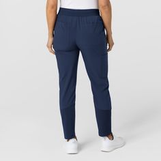 Designed for unparalleled comfort and mobility, our Wink Women's Flex-n-Reach Track Scrub pants will become your new workwear essential. Crafted with a luxurious four-way stretch fabric, they feel as cozy as your cherished yoga leggings. The jogger-style cut, with knit inserts at the calf, allows you to move freely, ensuring every task is a breeze.Say goodbye to restrictive work attire, thanks to our innovative Flex-n-Reach panels strategically placed to provide extra stretch where you need it m Versatile Full-length Sweatpants For Work, Utility Workwear Pants With Elastic Waistband, Utility Style Bottoms With Elastic Waistband For Work, Utility Style Workwear Bottoms With Elastic Waistband, Functional Mid-rise Pants With Comfort Waistband, Functional Mid-rise Bottoms With Hip Pockets, Stretch Bottoms With Tapered Leg And Functional Pockets, Stretch Bottoms With Functional Pockets And Tapered Leg, Versatile Comfort Stretch Pants With Side Pockets