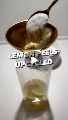 a spoon full of lemon peels upcycled on a white surface with the words lemon peels upcycled above it