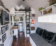 the interior of a tiny house with pictures on the wall